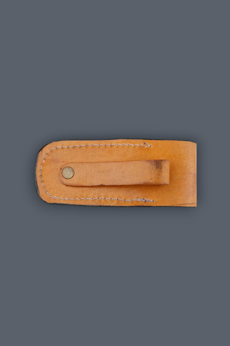 A light tan leather knife sheath with a stitched loop and a brass rivet, shown against a solid dark gray background.