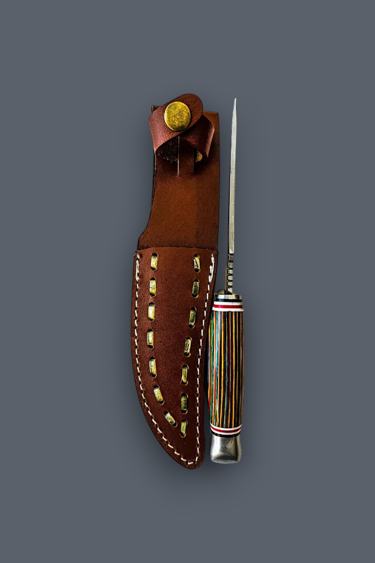 A handcrafted knife with a striped multicolor handle and a silver bolster, displayed next to its brown leather sheath with gold-toned metal accents on a solid dark gray background.