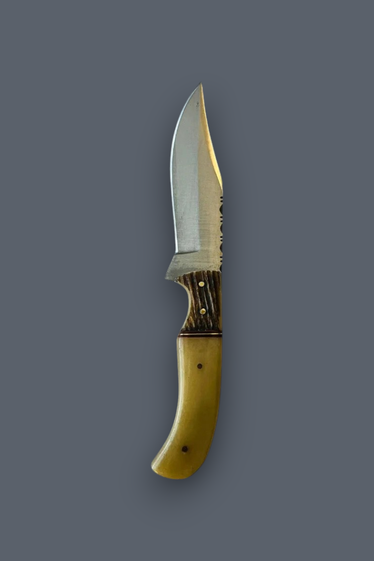 A fixed-blade knife with a silver steel blade, a dark brown stag horn bolster, and a curved yellow bone handle, shown vertically against a solid dark gray background.