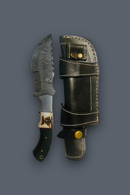 A fixed-blade knife with a patterned steel blade, dark handle, and decorative collar, shown next to its black leather sheath with brass snaps on a dark gray background.