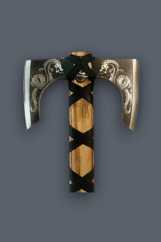 A Viking-style bearded axe with engraved dragon motifs on the steel blades, a wooden handle wrapped in black leather, and a central horn-like loop, shown against a solid dark gray background.