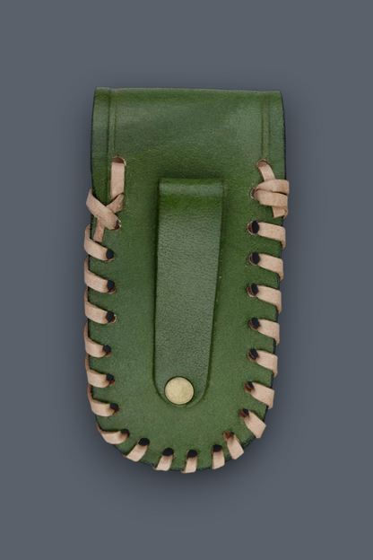 A green leather pouch with a central strap and decorative light tan stitching along the edges, shown against a dark gray background.