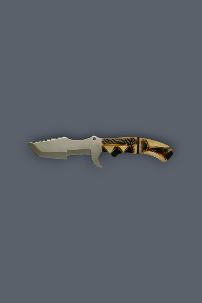 A fixed-blade knife with a silver-gray metal blade and a textured handle featuring black and tan wood-like patterns, shown against a solid dark gray background.