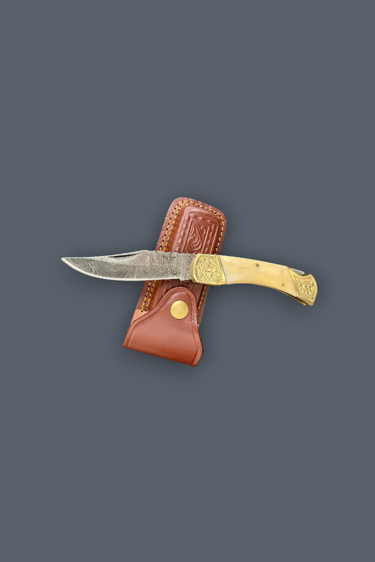 A folding pocket knife with a silver steel blade, a light tan bone handle, and a brown leather sheath, displayed against a solid dark gray background.