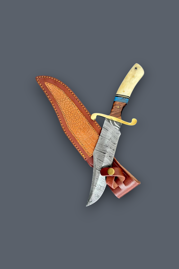 A fixed-blade knife with a patterned steel blade, a brown leather sheath, and a cream-colored handle, displayed diagonally on a solid dark gray background.