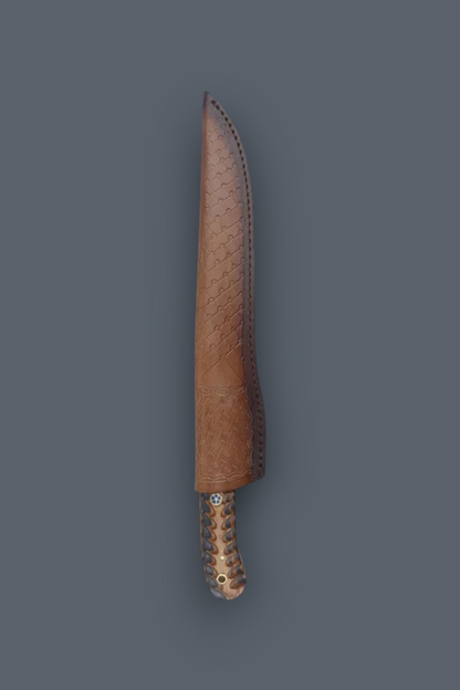 A fixed-blade knife with a textured brown leather sheath and a patterned copper-toned handle, shown vertically against a solid dark gray background.