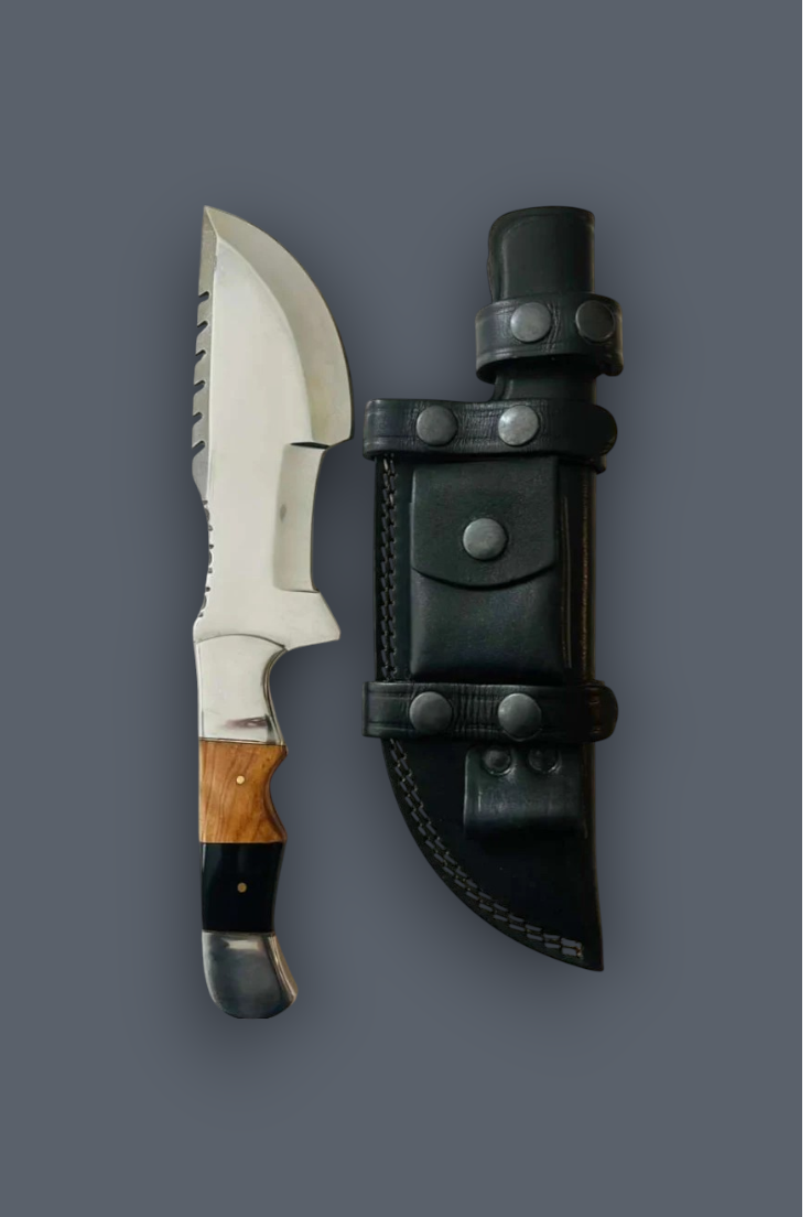 A fixed-blade knife with a silver blade, black handle, and brown wood inlay, shown next to a black leather sheath on a solid dark gray background.