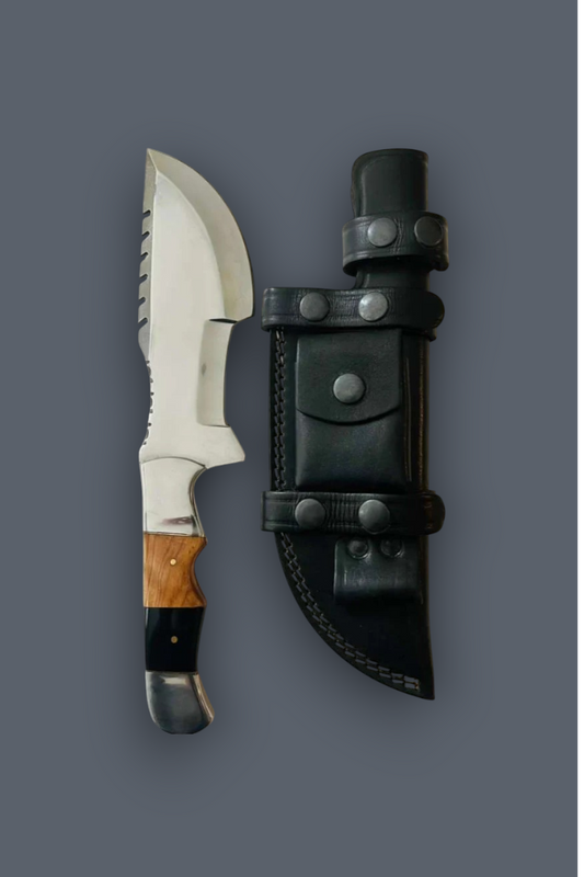 A fixed-blade knife with a silver blade, black handle, and brown wood inlay, shown next to a black leather sheath on a solid dark gray background.