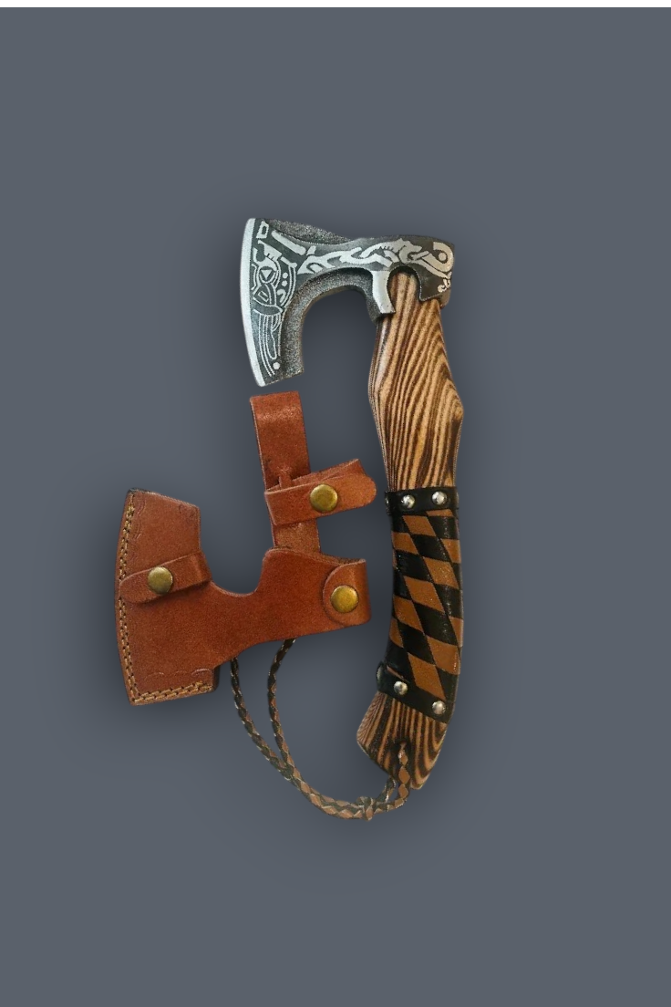 A decorative axe with an engraved silver-toned metal head, a striped brown and beige handle, and a brown leather sheath with brass snaps, shown on a solid dark gray background.