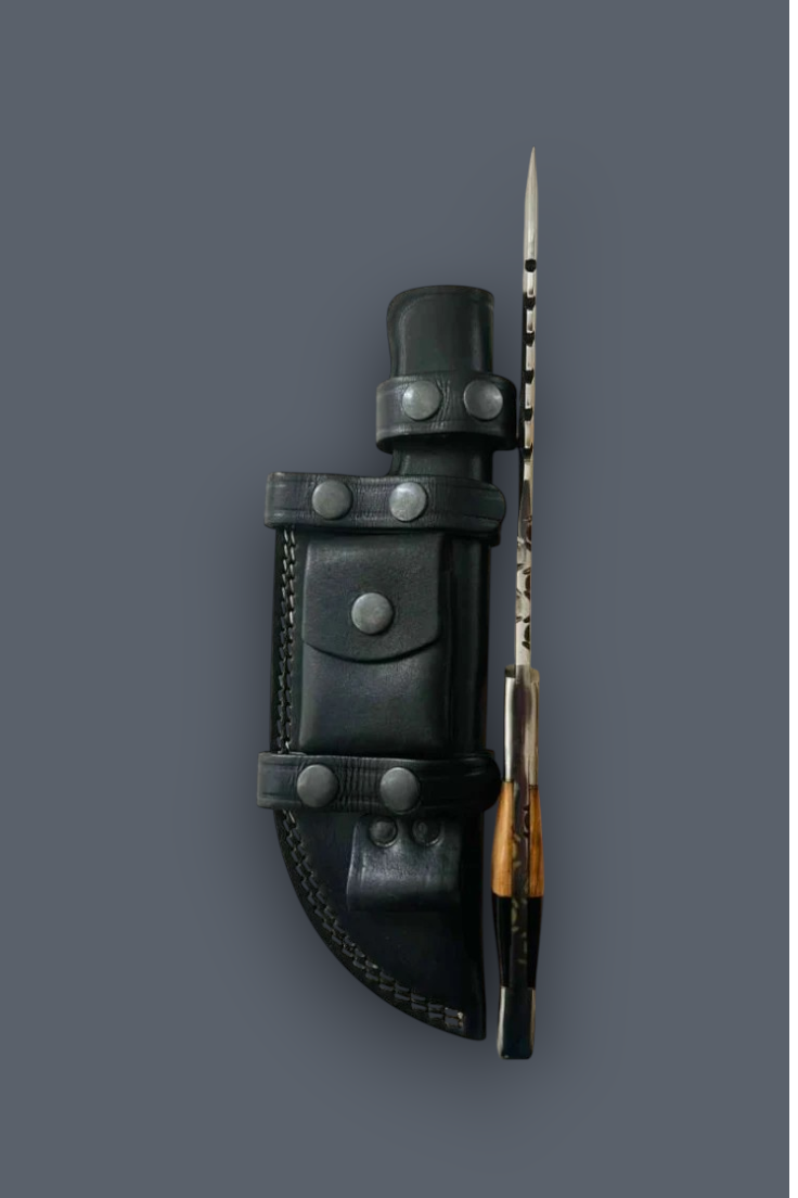 A fixed-blade knife with a silver blade, black handle, and brown wood-toned bolster, shown standing next to its black leather sheath with metal snaps, on a solid dark gray background.