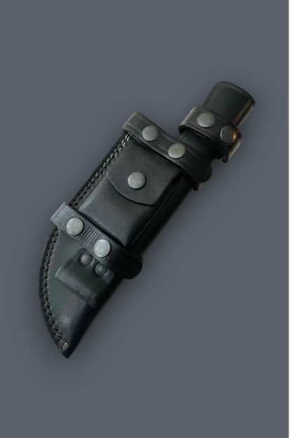 A black leather knife sheath with silver-toned metal rivets and a matching black leather belt loop, shown on a solid dark gray background.