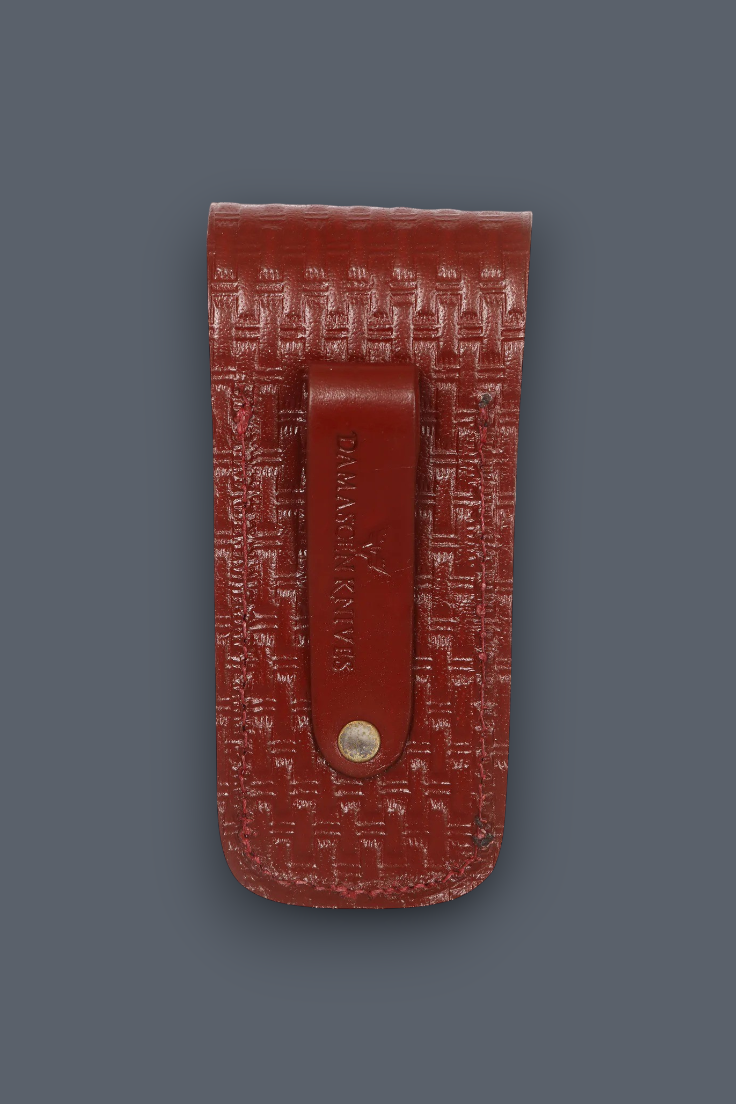 A reddish-brown leather money clip wallet with a textured basketweave pattern, featuring a central leather tab with the brand name 'STATION 66' and a small gold-tone snap button, set against a solid dark gray background.