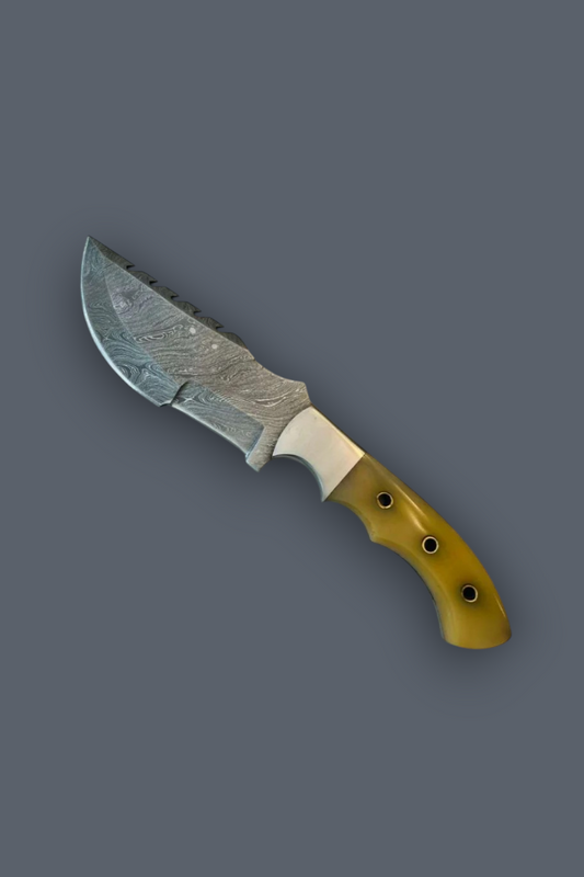 A fixed-blade knife with a patterned steel blade and a yellow-gold handle, shown diagonally on a solid dark gray background.
