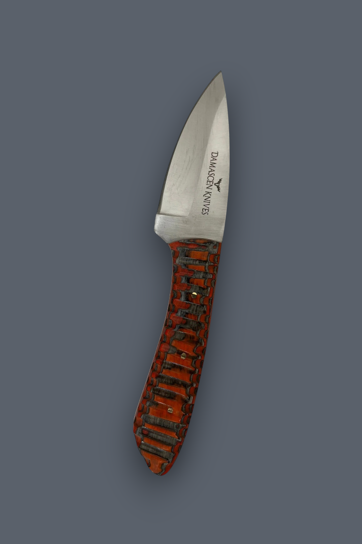 A fixed-blade knife with a satin-finished silver blade and a textured reddish-brown handle with black inlay, shown on a solid dark gray background. The brand 'DIAMAGNA KNIVES' is printed on the blade.