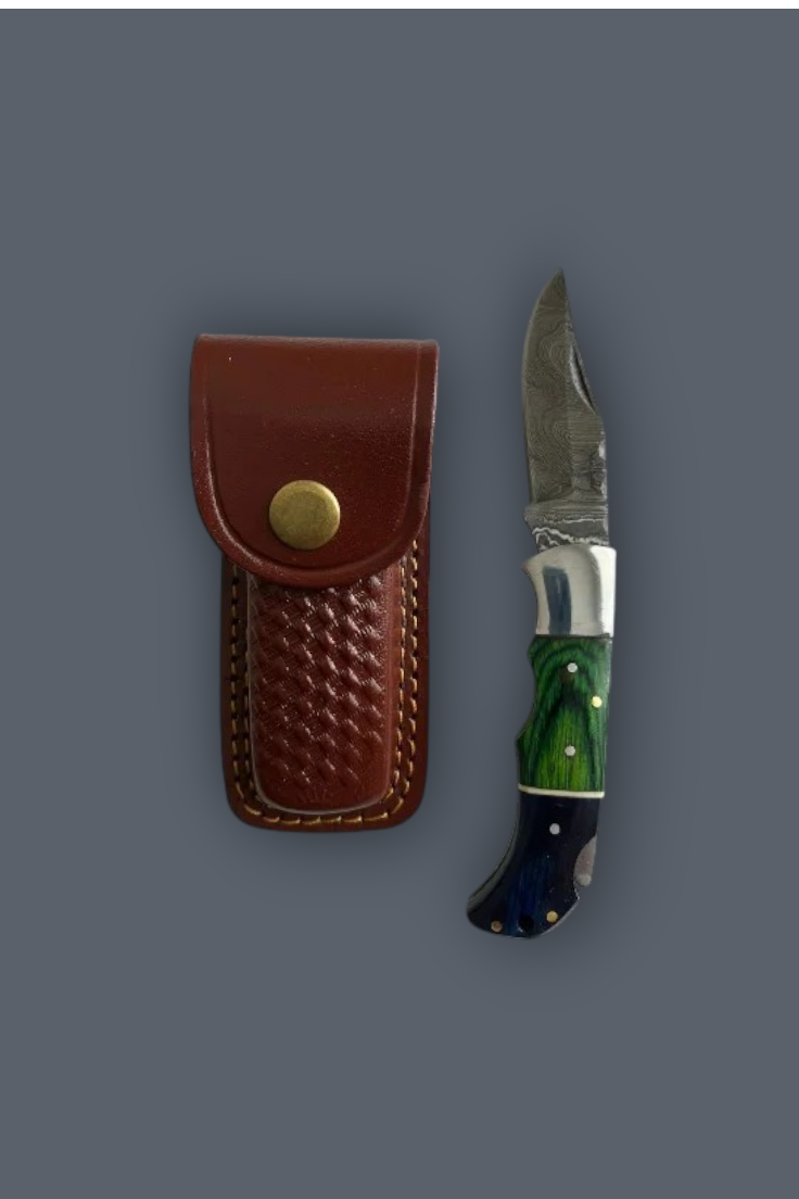 A folding pocket knife with a green and blue marbled handle and a silver blade, shown next to its brown leather sheath with a brass snap button, set against a solid dark gray background.