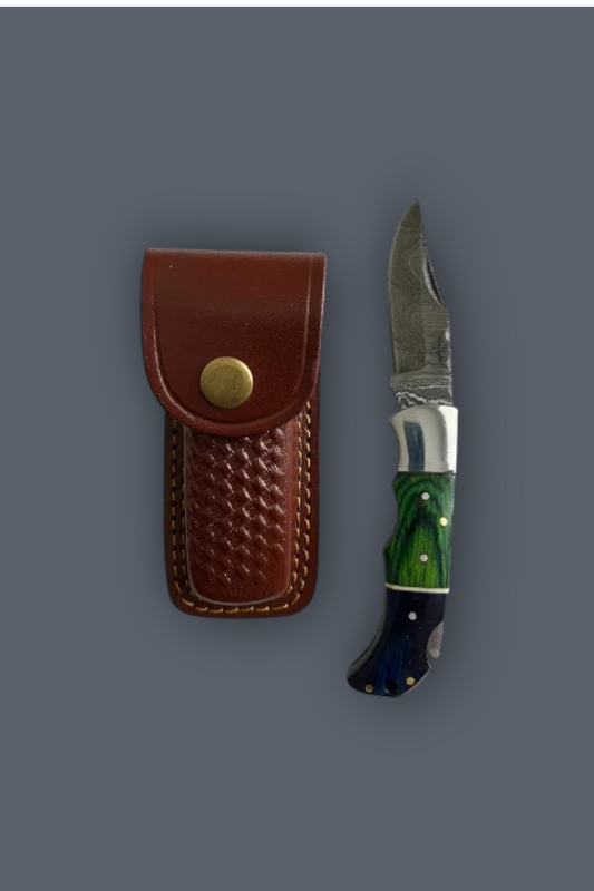 A folding pocket knife with a green and blue marbled handle and a silver blade, shown next to its brown leather sheath with a brass snap button, set against a solid dark gray background.