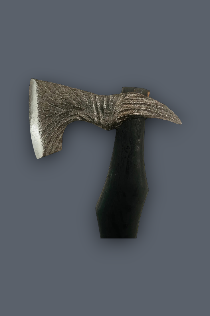 A miniature decorative axe or hatchet with a textured, metallic silver-gray blade and a dark, glossy black handle, set against a solid dark gray background.