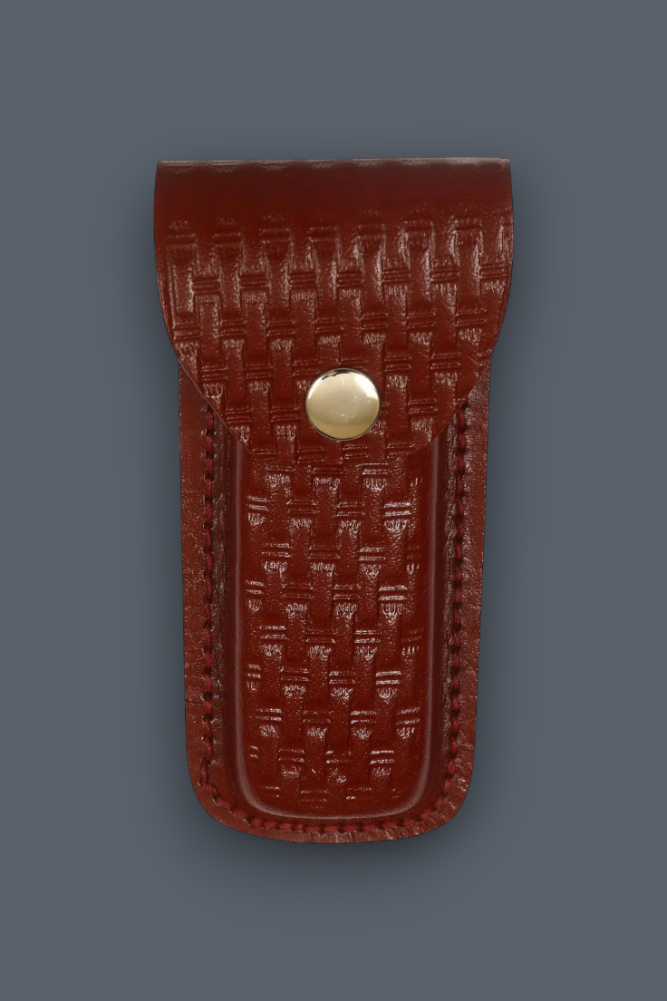 A reddish-brown leather pouch with a textured, embossed basketweave pattern and a gold-toned snap button closure, shown against a solid dark gray background.