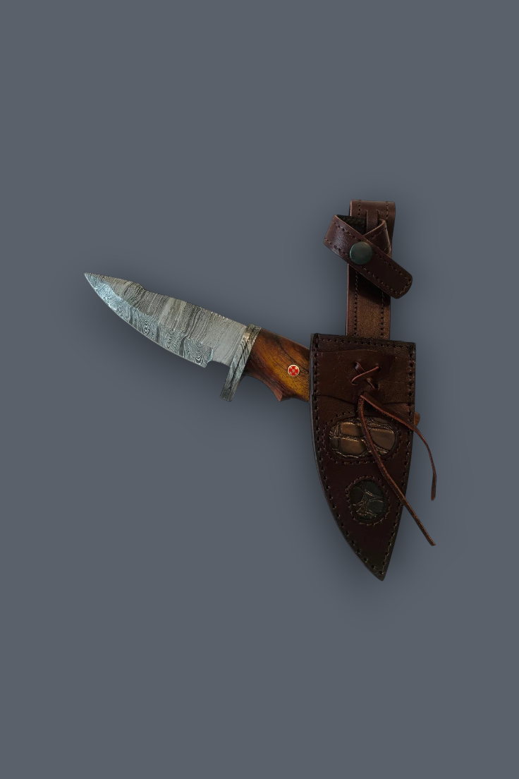 A fixed-blade knife with a silver-gray patterned blade, brown wooden handle, and a brown leather sheath, shown against a solid dark gray background.