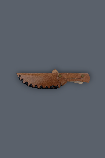 A small fixed-blade knife with a brown leather sheath, shown horizontally against a solid dark gray background.