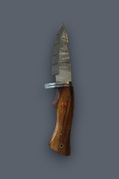 A custom fixed-blade knife with a textured, patterned steel blade and a polished brown wooden handle, shown vertically against a solid dark gray background.