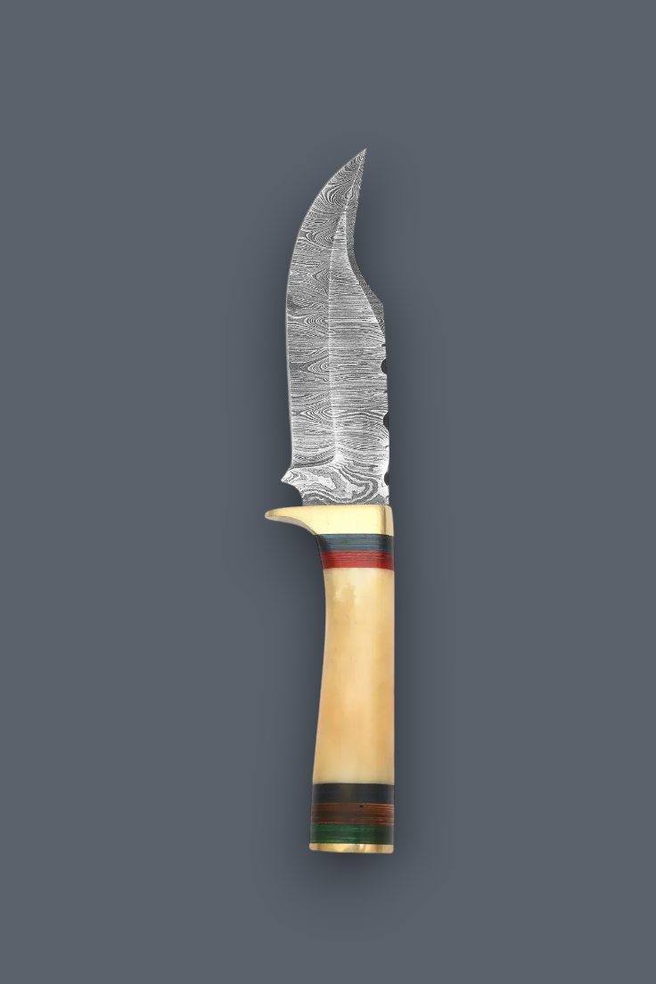 A decorative fixed-blade knife with a patterned Damascus steel blade, a curved cream-colored bone handle, and colorful striped accents in red, green, and gold, set against a solid dark gray background.
