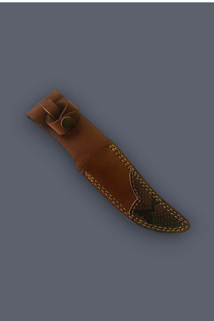A brown leather knife sheath with decorative stitching and a brass snap button, shown diagonally on a solid dark gray background.