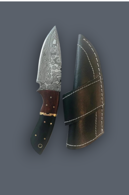 A fixed-blade knife with a patterned steel blade, brown handle, and black handle, shown next to its black leather sheath on a dark gray background.