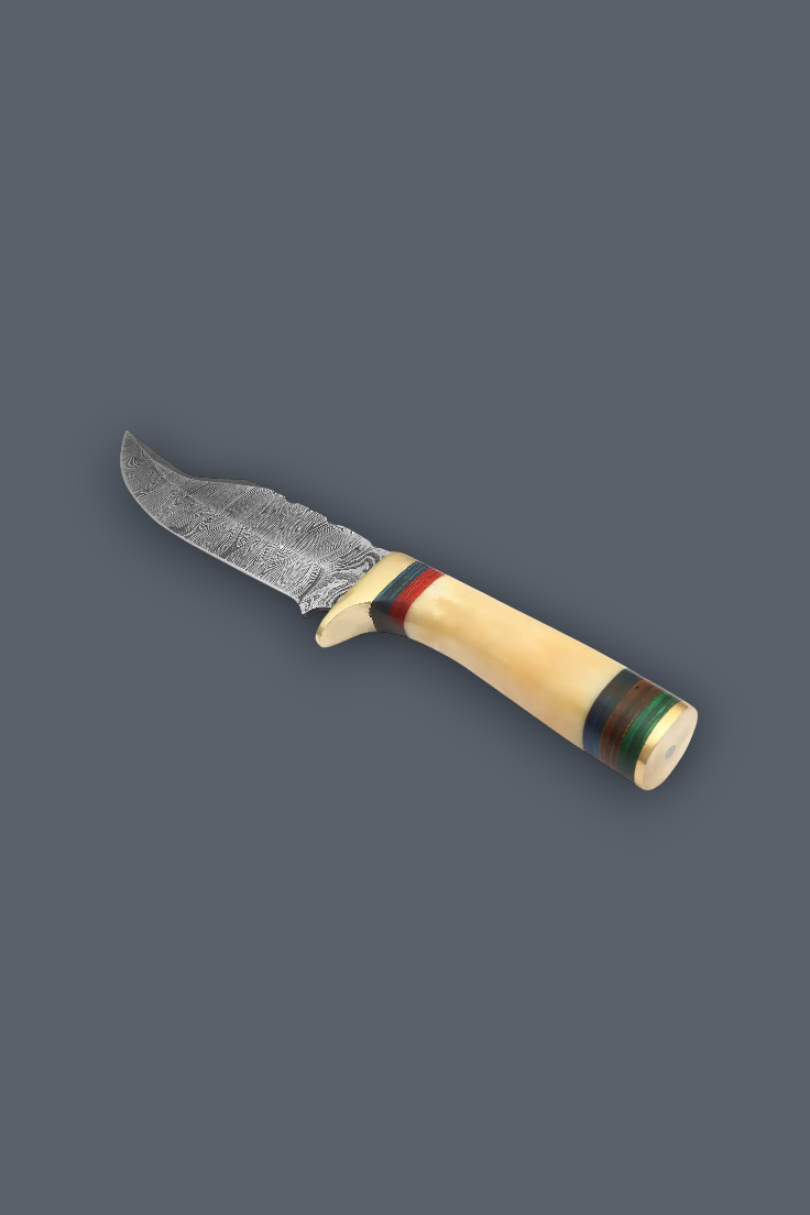 A fixed-blade knife with a textured, patterned steel blade and a curved handle made of natural bone, decorated with red, green, and blue stripes, shown on a solid dark gray background.