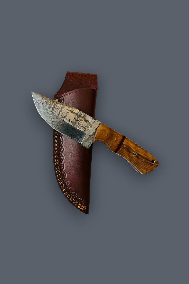 A fixed-blade knife with a patterned steel blade, a brown wooden handle, and a brown leather sheath, displayed diagonally against a solid dark gray background.