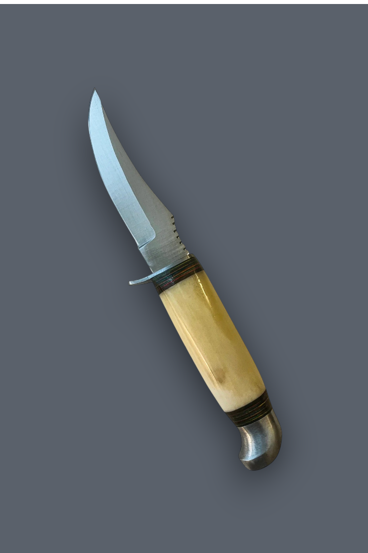 A fixed-blade knife with a curved silver steel blade, a polished light tan bone handle, and dark metal bands, shown diagonally on a solid dark gray background.