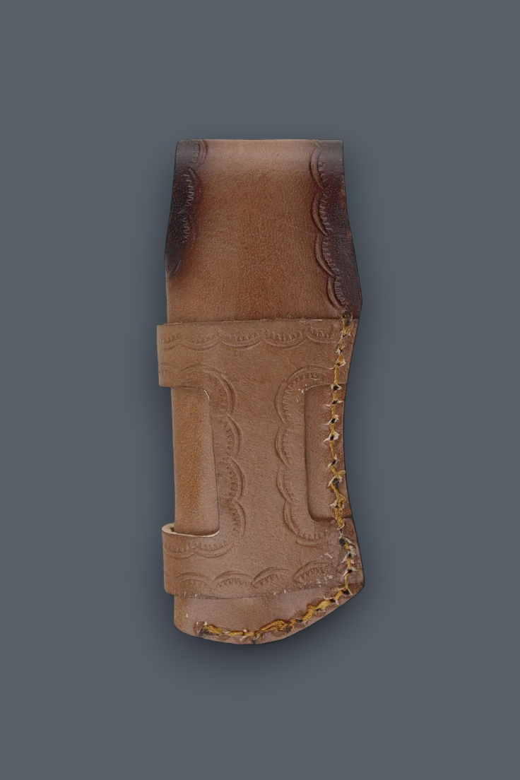 A brown leather knife sheath with hand-tooled floral patterns and a stitched edge, shown against a solid dark gray background.