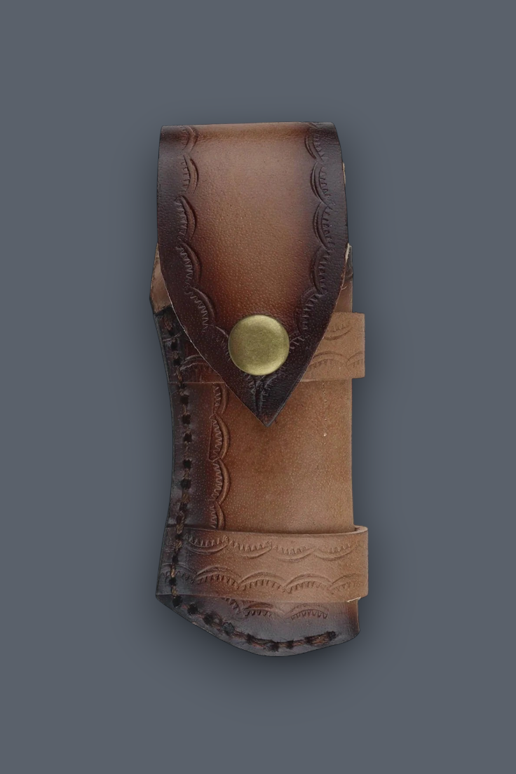 A brown leather knife sheath with hand-tooled floral patterns and a brass snap button, shown against a solid dark gray background.