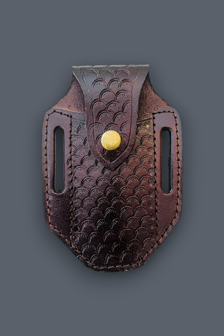 A dark brown leather belt holster with a scalloped embossed pattern and a gold snap button, shown against a solid dark gray background.