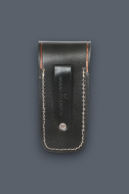 Back view of handmade black leather folding knife sheath featuring a durable belt loop for everyday carry (EDC).