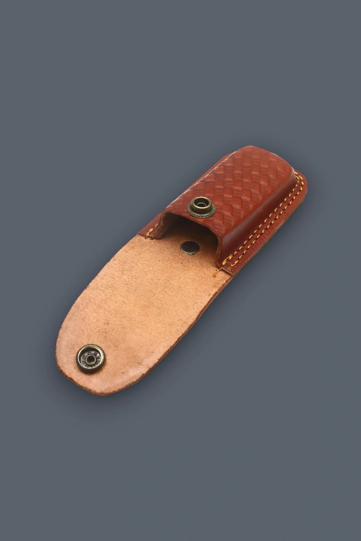 Open brown leather sheath featuring a basketweave pattern and snap closure for the Pioneer Pocket folding knife.