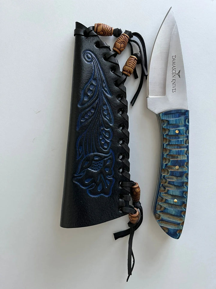 Close-up of Blue Phantom hunting knife blade showing high-grade stainless steel edge and fine craftsmanship.