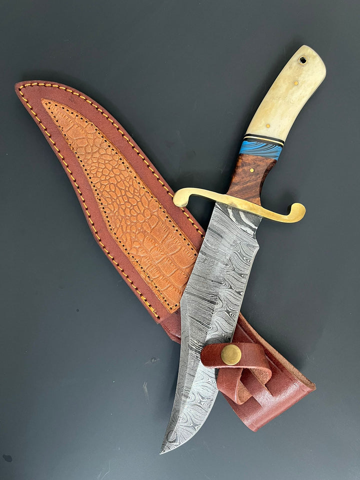 Angled view of Bowie knife half-inserted into handcrafted leather sheath