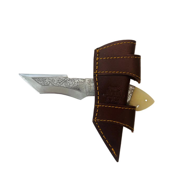 Bone handle Damascus knife stored inside handcrafted leather sheath