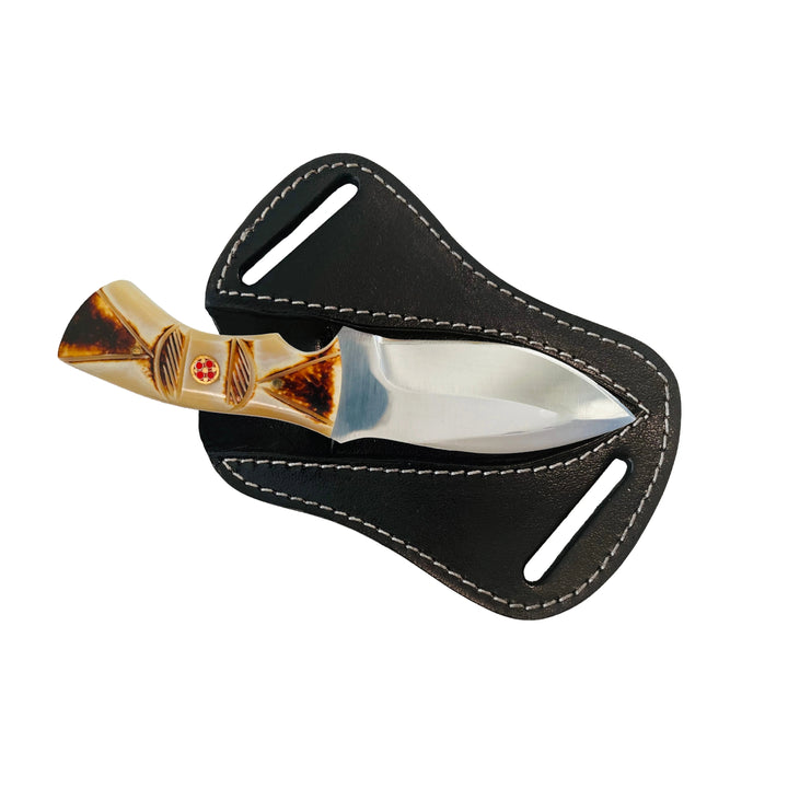 Display of 4-inch Damascus fixed blade knife with bone handle and matching sheath.