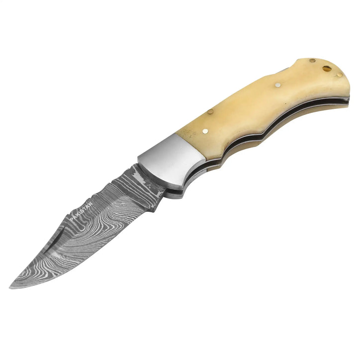Top view of Damascus folding knife with bone grip