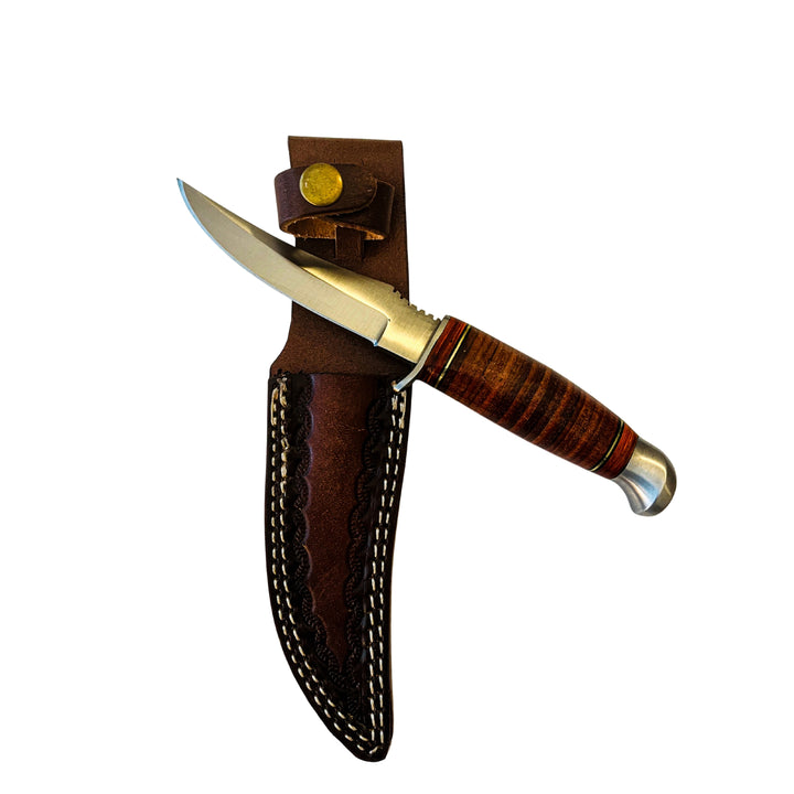 Handcrafted Damascus hunting knife displayed with brown leather sheath