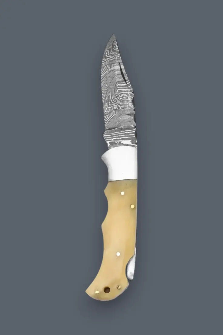 Full length view of the lockback Damascus folding knife highlighting the layered steel blade.