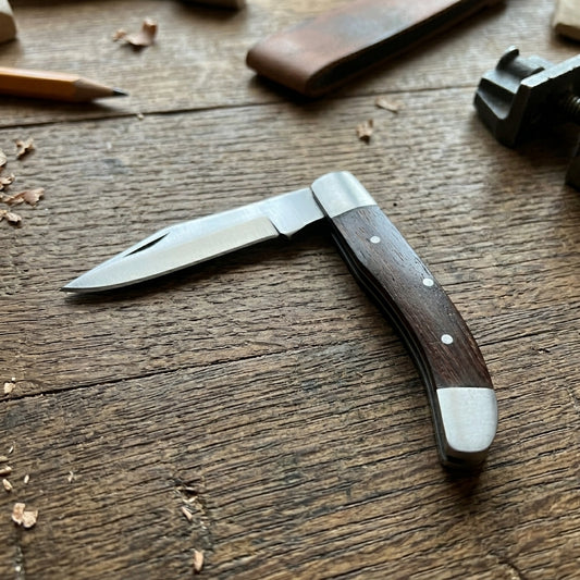 Stainless steel folding pocket knife blade with nail nick
