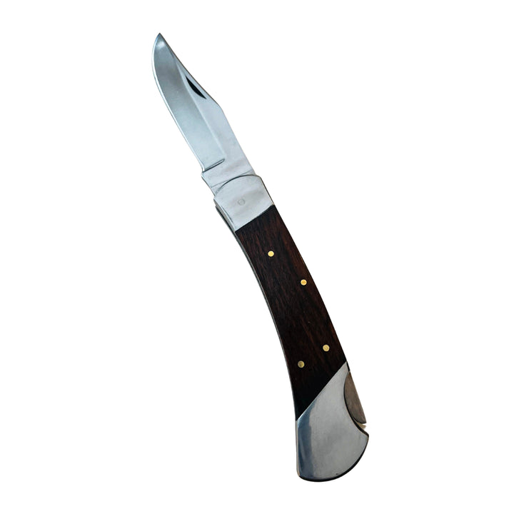 Angled view of Puma Classic Damascus folding knife with dark wooden handle