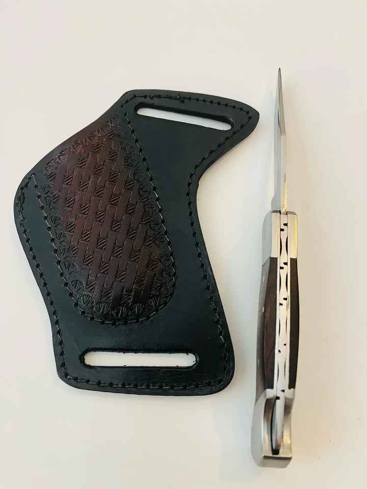 Puma Lockback Folding Knife next to hand-stitched leather sheath