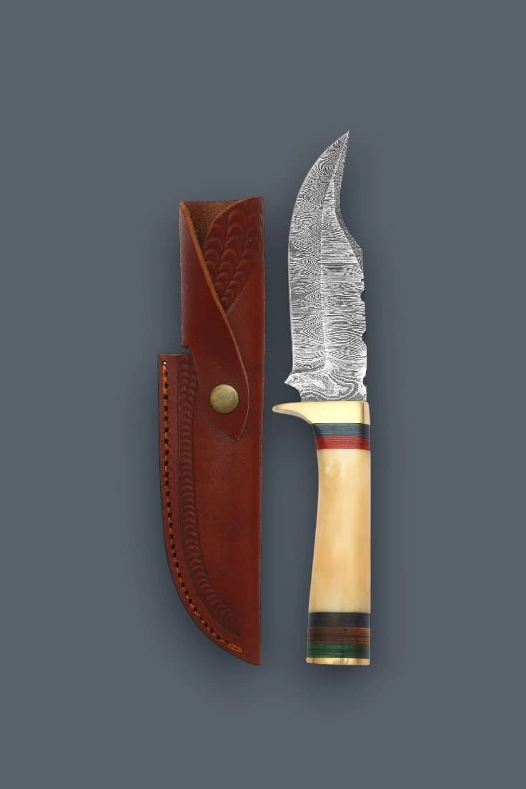 Vertical flat lay of a Damascen Knives fixed blade hunting knife with a banded bone handle, displayed alongside its stamped genuine leather sheath.