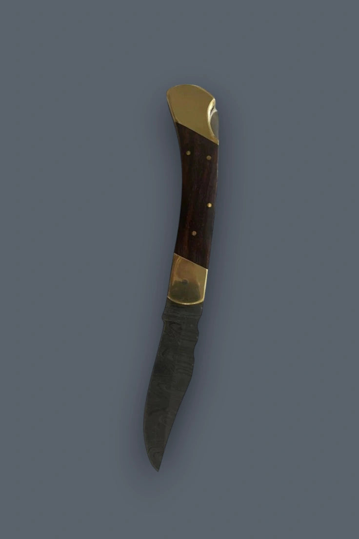 Vertical profile of the fully open Old World Edge knife showcasing the Damascus blade and wood handle.