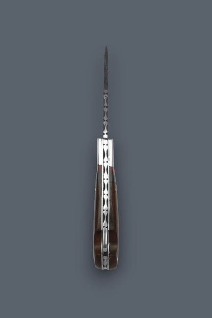 Vertical edge-on profile of the fully open The Gentry Knife highlighting the symmetrical wood handle construction and intricate spine filework.