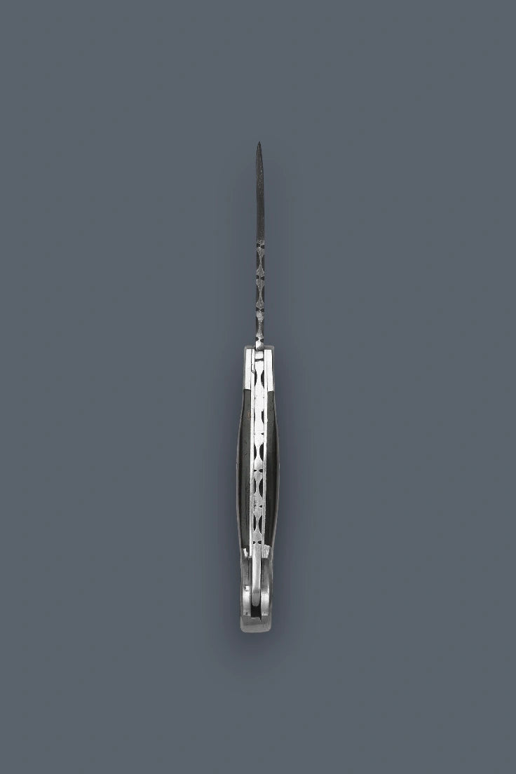 Vertical edge-on profile of the fully open The Squire Damascus folding knife showcasing the intricate spine filework and symmetrical handle assembly.